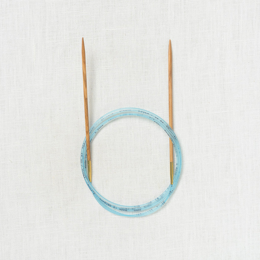 Addi Olive Wood Fixed Circular 60"