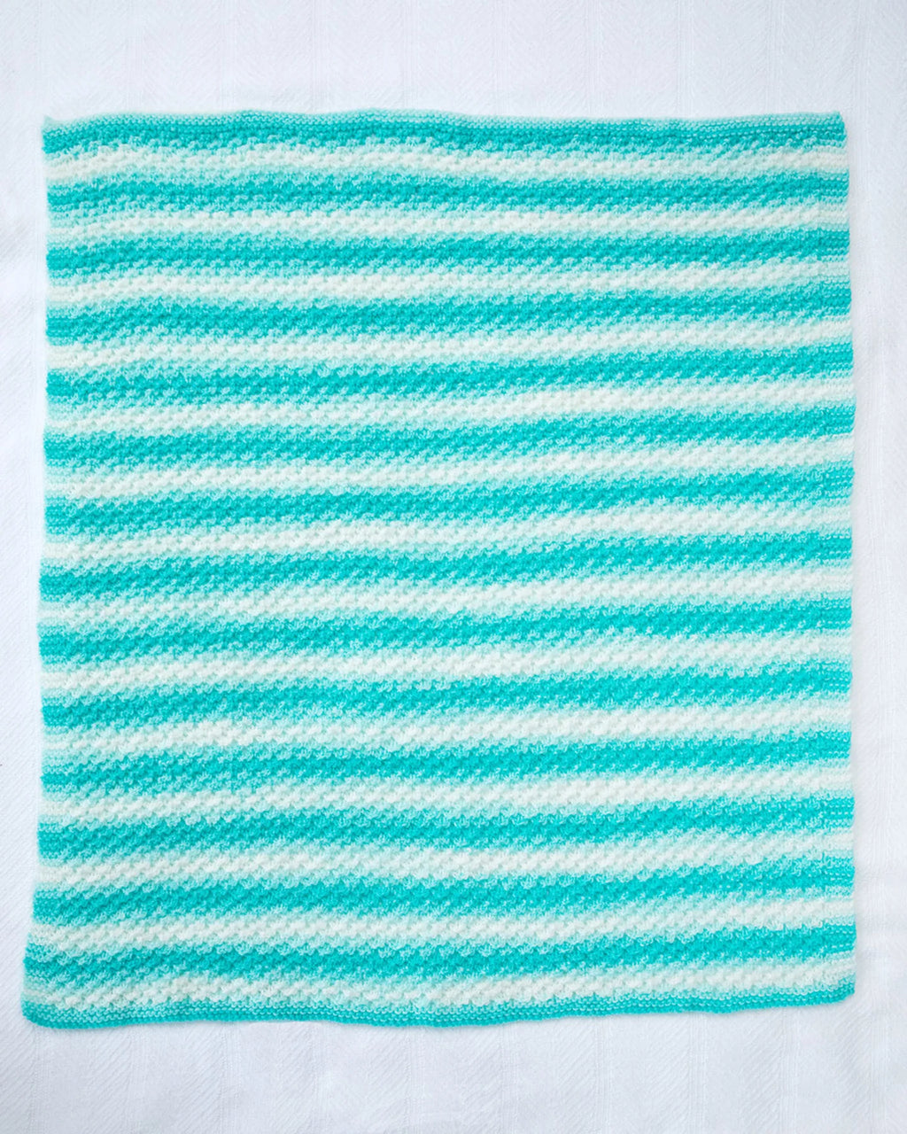 Textured Baby Afghan (Knit) by Lion Brand Yarn